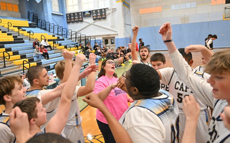 Cape coach Katie Collick gets her team pumped up for the fourth quarter.