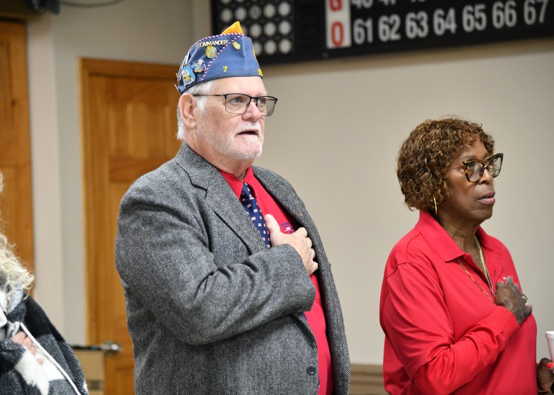 Saluting the flag are Rick Wheatley, Sons of the American Legion Delaware Detachment commander, and Tina Washington, Unit 28 PR chair.