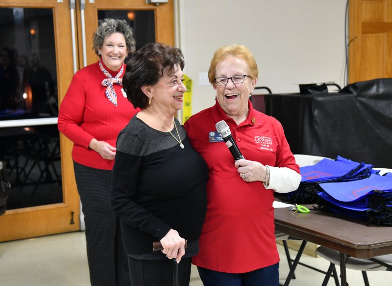 Unit 28 Auxiliary President June Jones, right, shares a light moment with 2025 Unit Member of the Year Roberta Halle Bass. In the background is Auxiliary Unit 28 Vice President Beth McGinn.