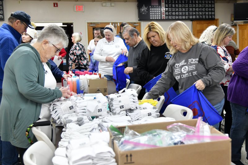 Post 28 members prepare bags for donation to at-risk veterans.