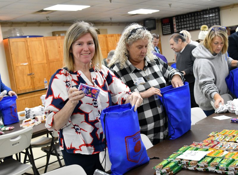 Volunteers stock the bags for the at risk vets. Shown are Maizie Windows, auxiliary Dept 2nd Vice president and Laura Smith Legion Auxilay, Dept of DE President.