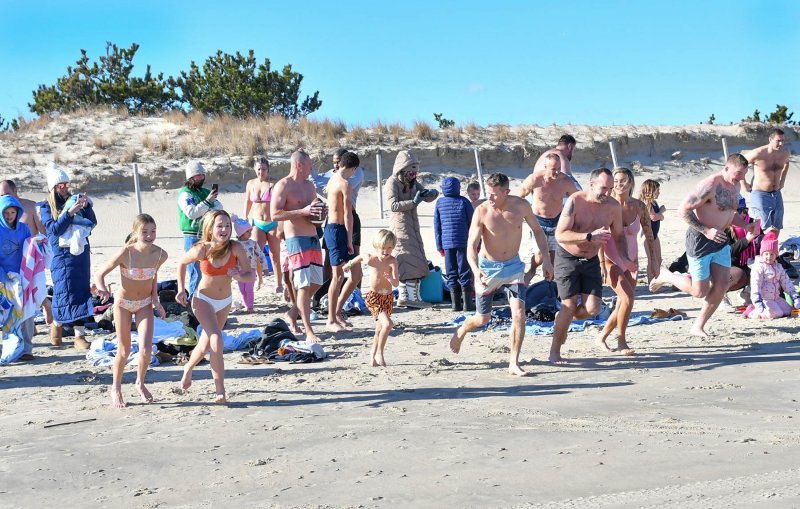 The first wave takes off for the ocean.