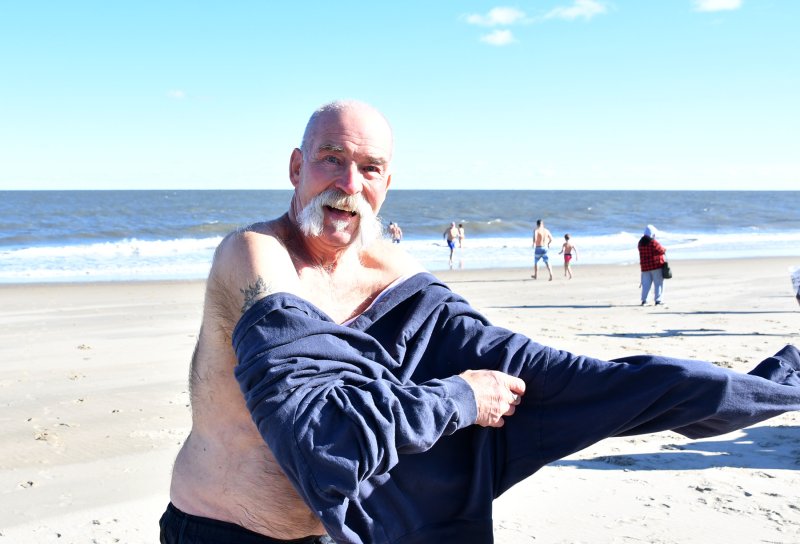 Veteran polar bear Chip Davis quickly gets into some warm clothes.