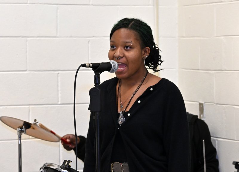 Sahreniti Jones of the Taylor Music Studio entertains the group with a song. DAN COOK PHOTOS