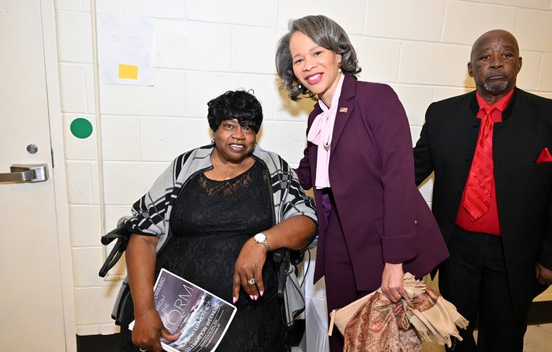Sen. Lisa Blunt Rochester gives a hug to Sunshine Circle Club’s Bernice Edwards. With them is Dr. Martin Luther King Jr. Celebration Organization Sussex County Inc. President Clem Jordan.