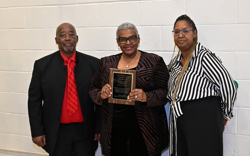 Presenting an award of appreciation for Stell Parker Selby are Clem Jordan and Katina Gooch. Accepting the award for Stell Parker Selby is her friend Jackie Briscoe.