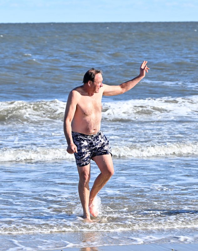 Veteran polar bear Bob Hughes says, “Towel, please.”