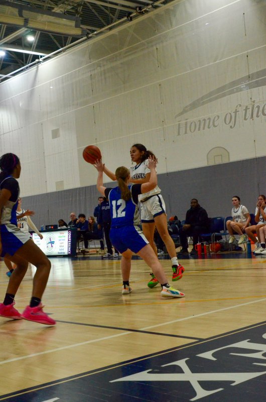 Sussex Academy freshman Barb Carneiro-Duarte passes the ball.