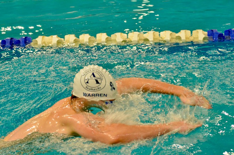 Seahawks sophomore Nicholas Warren breaks the surface of the water.