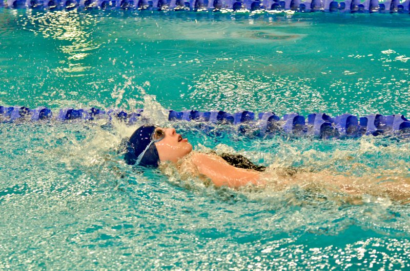 Sussex Academy eighth-grader Eliza Evans backstrokes during the individual medley.