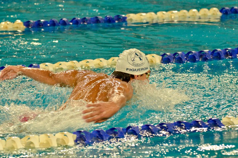 Sussex Academy senior Angel Figueroa flies to first in the butterfly.