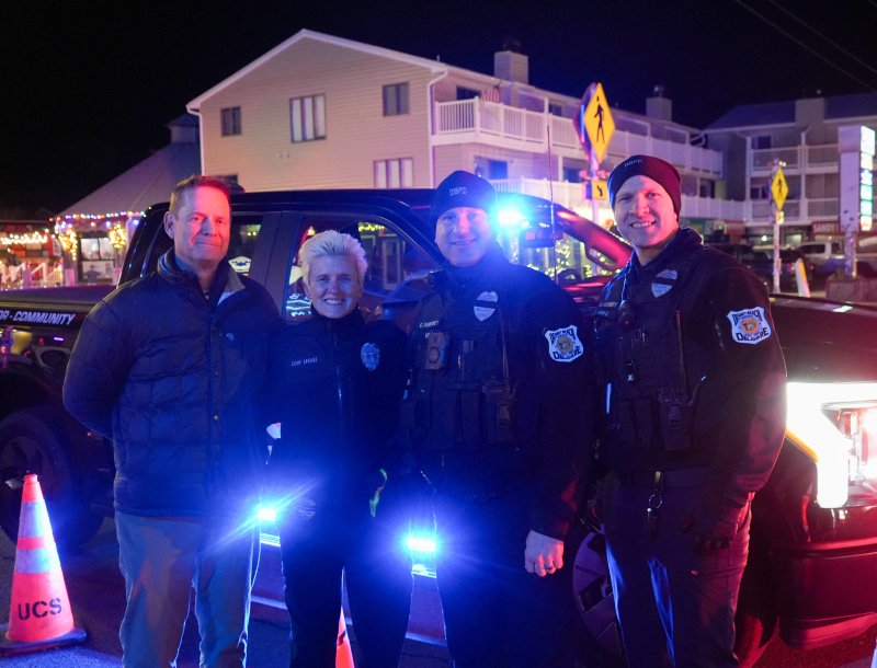 Dewey Beach town officials gather during the Crush Drop. Shown are (l-r) Town Manager Bill Zolper, Police Chief Constance Speake, Lt. Cliff Dempsey and Sgt. Colin Schmidt.