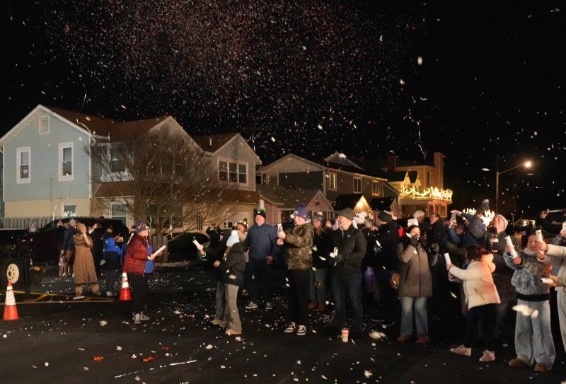 Dewey Beach residents and visitors celebrate at midnight with confetti.