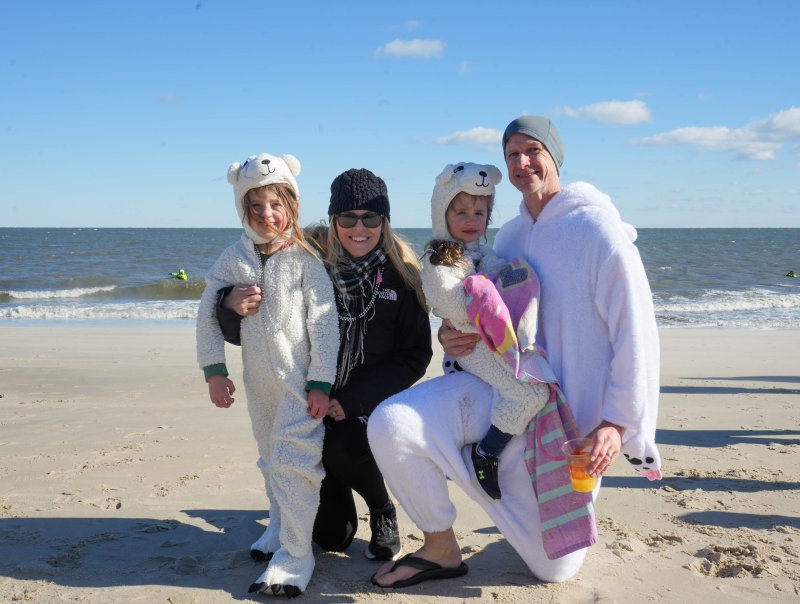 The Usefara family is ready for the Dewey Dunk in their matching fuzzy onesies. Shown are (l-r) Ava, Karen, Mark and Olivia.