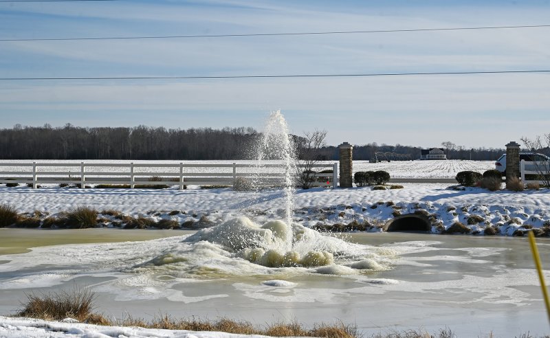 Ice piles up around the fountain at Red Mill Pond South on Route 9 near Milton.