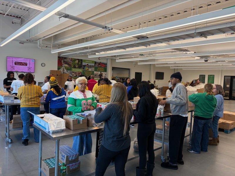 Volunteers assemble at the Food Bank of Delaware in Milford to put together food boxes for children in Delaware.