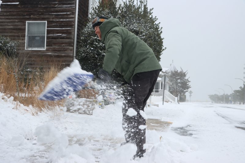 Sean Wood was out early shoveling on Lake Avenue in Rehoboth Beach. BILL SHULL PHOTO