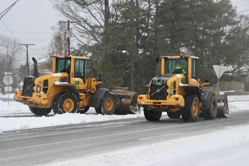 Dueling plows on Coastal Highway in Dewey Beach. BILL SHULL PHOTO