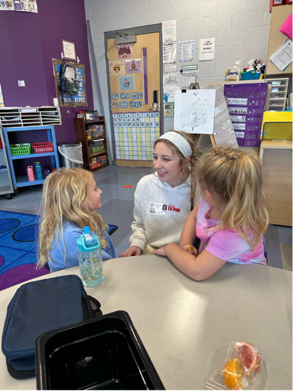 Student Hailey Bohan shares a conversation with Rachel Wharton, left, and Ridley Grimm.