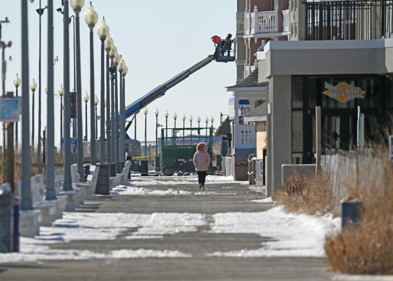 The Rehoboth Boardwalk isn’t easy to traverse in the chilly temperatures and offshore winds.