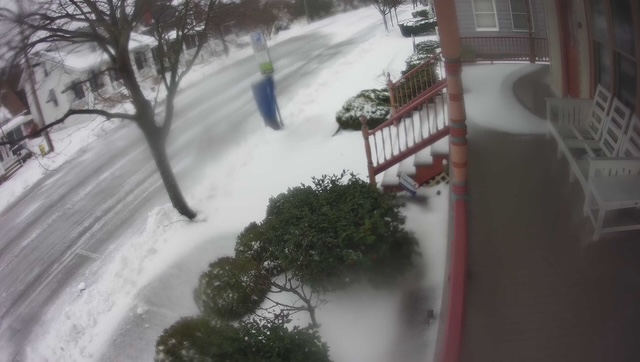 Patrician Smith said that usually the problem is keeping the sunlight off of the porch on Brooklyn Avenue, but today they need to keep the snow off of the porch.