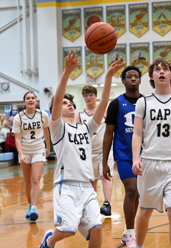 Cape sophomore Xavier Zimmer shoots off an assist by junior unified partner Aidan Wyatt.