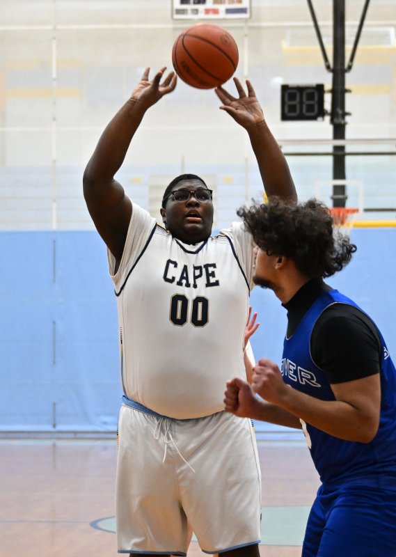 Freshman Jaylin Tingle hits over the defense.