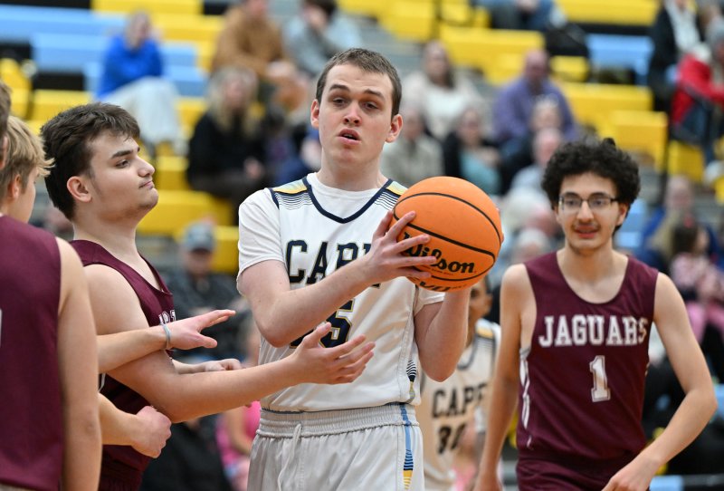 Dan Gartman battles for a rebound with Appo’s Trevor Jaques.