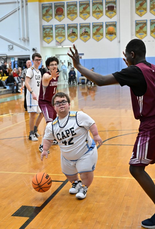Cape’s Norman Rust drives on the Jags’ Papa Marfo.