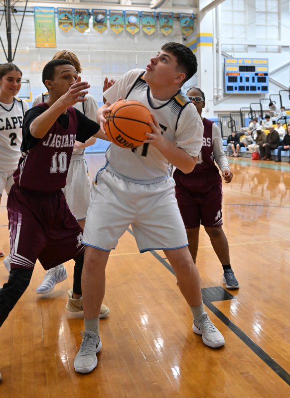 Cape’s Michael Anthony looks to go up on the Jags’ Stacy Duker.