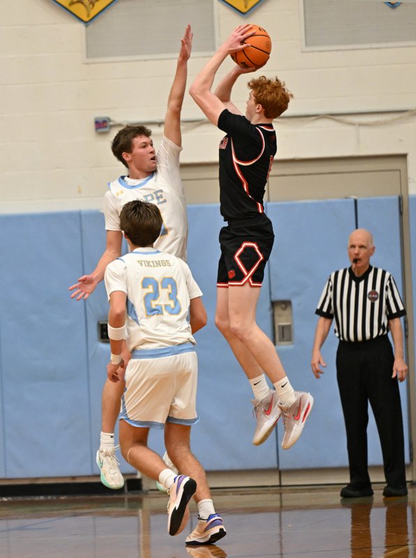 Cape senior Lawson Whale alters the shot of Polytech’s Jackson Arndt. DAN COOK PHOTO