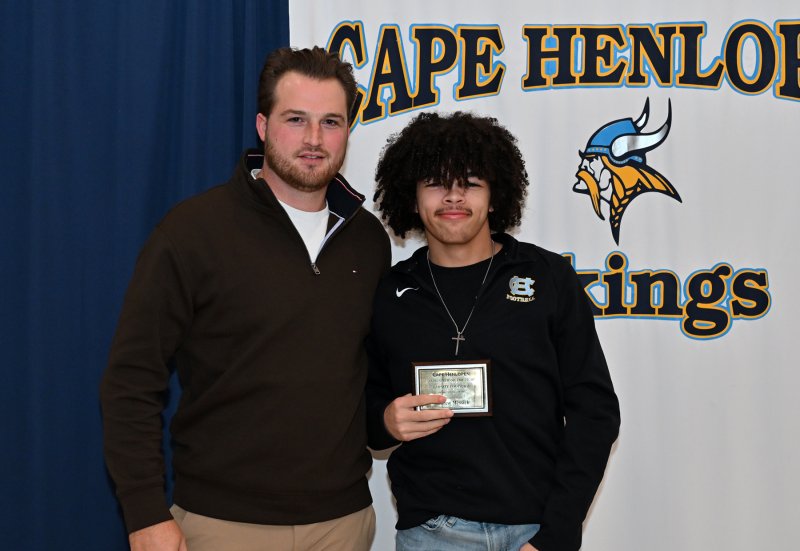 Cape coach Ben Ashby presents the Newcomer of the Year Award to Drew Messick.