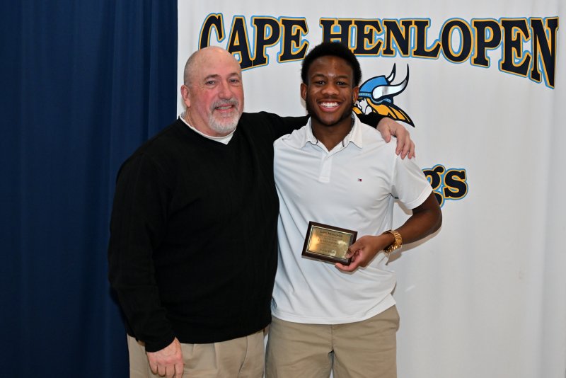 Coach Steve Walsh presents the Special Teams Player of the Year to punter Navin Duffy.