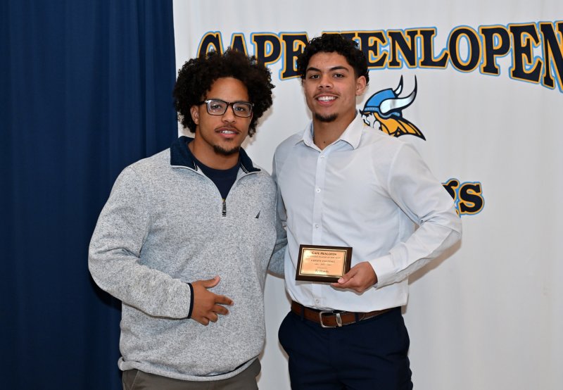 Running backs coach Jaden Davis presents the Offensive Player of the Year Award to Ty Handy. Handy had 451 yards rushing and 238 yards receiving.