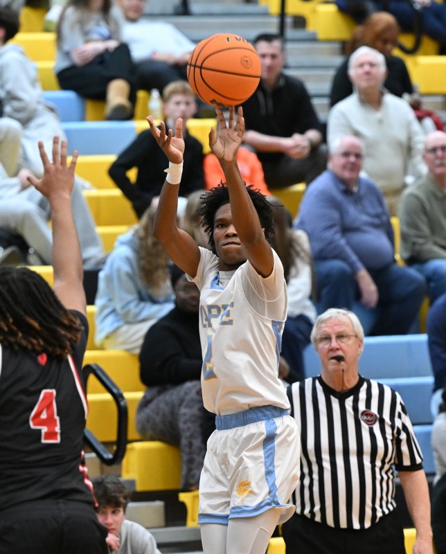 Cape junior Geordan Downing knocks down a three over Polytech. He scored 16 points in the win over the Panthers. DAN COOK PHOTO