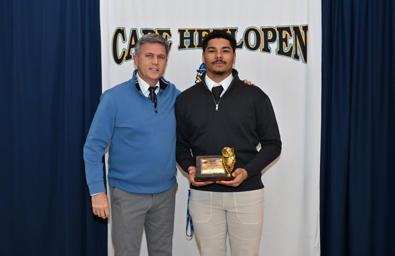 Cape head coach Chip Knapp presents the Viking Award to senior Dell Richards. Richards had 38 receptions for 514 yards.