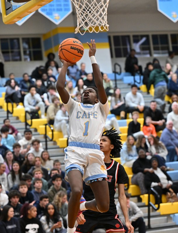 Cape junior Stephen Sivels glides in for two of his 17 points against the Panthers. DAN COOK PHOTO