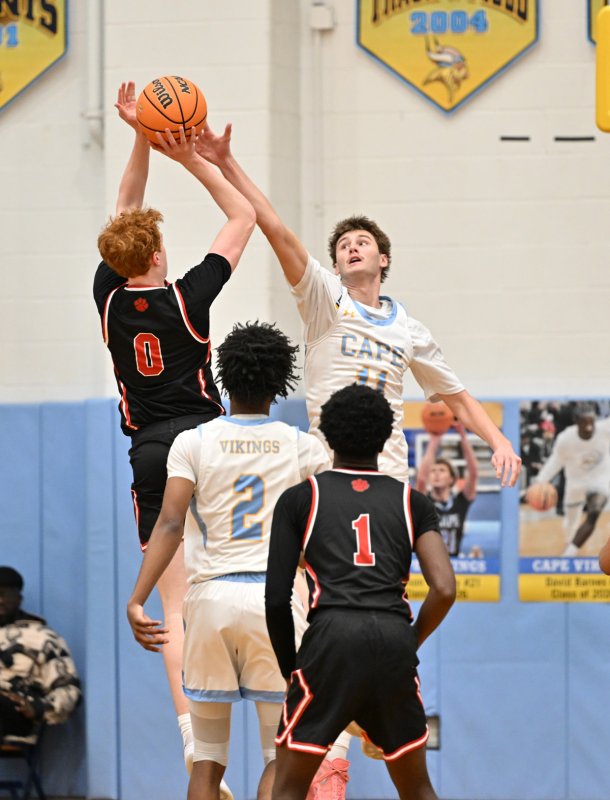 Cape senior Braxton Figgs blocks a shot by Panthers junior Jackson Arndt. DAN COOK PHOTO