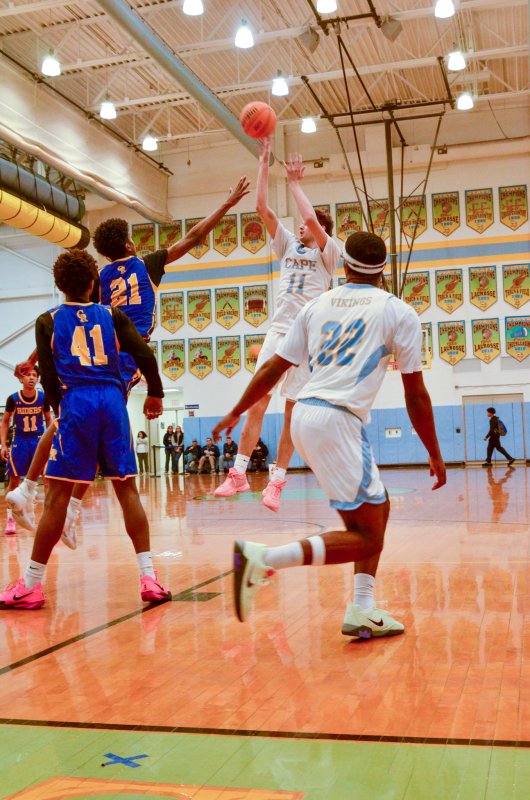 Vikings senior Braxton Figgs clears his hands for a shot. AARON R. MUSHRUSH PHOTO