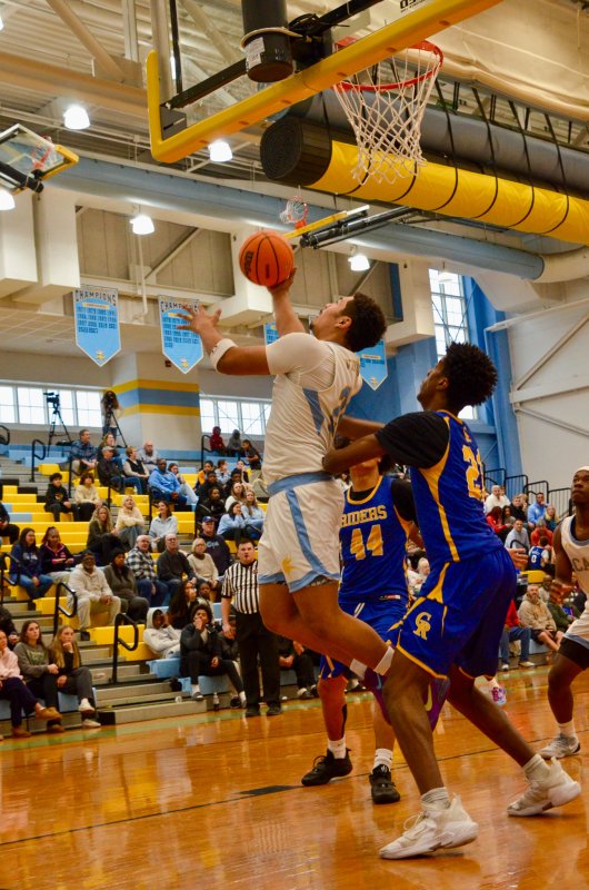Cape senior Dell Richards is fouled on this up-and-under. AARON R. MUSHRUSH PHOTO