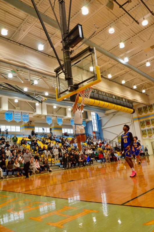Cape junior Jameson Tingle slams the ball home on an alley-oop pass from Steve Sivels. AARON R. MUSHRUSH PHOTO