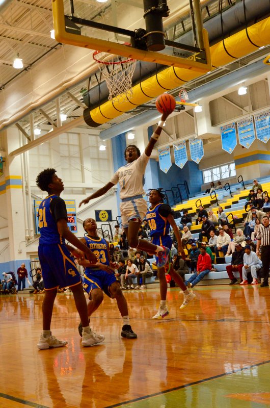 Vikings junior Steve Sivels keeps the ball clear on this layup. AARON R. MUSHRUSH PHOTO