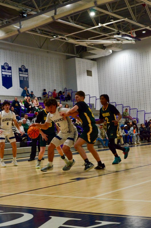 Seahawks sophomore Mason Glover gets pushed in the back.