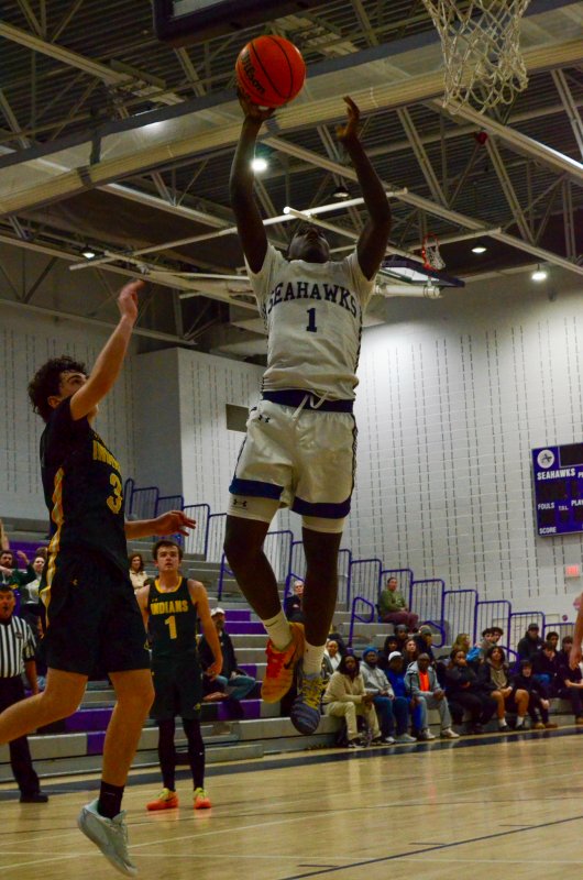 Sussex Academy sophomore Farmar Amisial finishes at the cup.