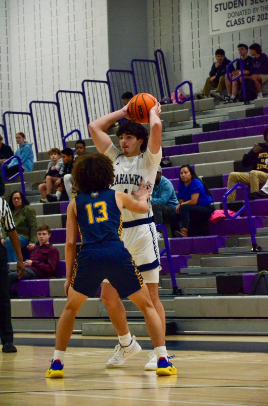 Sussex Academy sophomore Ben Tollett looks for an open teammate.