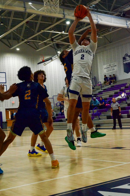 Seahawks sophomore Mason Glover gets a hand to the face on this finish.