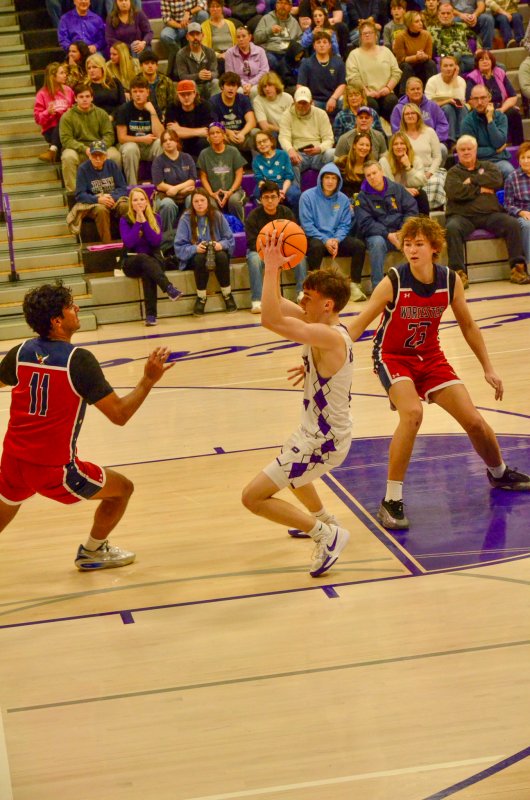 Royals sophomore Asher Woods splits the two Mallards.