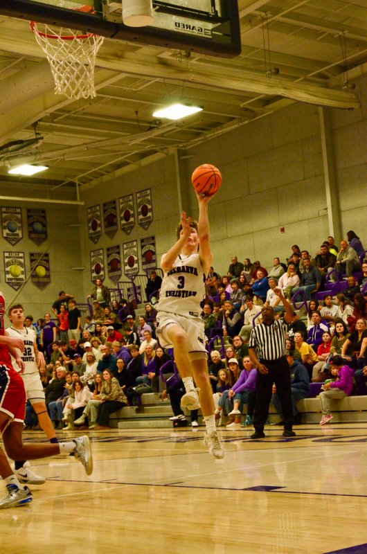 Delmarva Christian junior Noah Barbrow adjusts mid-flight.