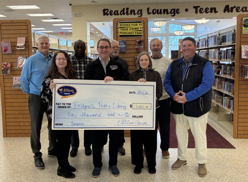 Check presentation attendees shown are (l-r) Tom Donovan, Allen Harim director of technical services; Karen Johnson-Kemp, Bridgeville library director; Randolph Jones, library board president; Mike Little, Allen Harim CEO; Roger Hovermale, Nadine Bravo and Tom Connar, library board members; and Erik Smith, Allen Harim regional director of sales and marketing. SUBMITTED PHOTO