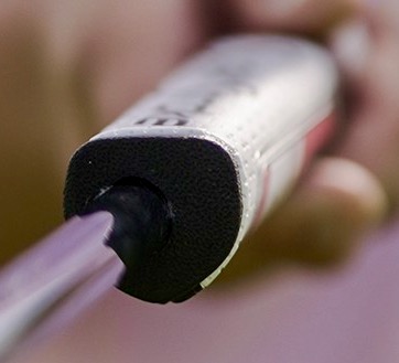 If you look carefully, you can see that the shaft hole on this SuperStroke putter grip is not centered, and forces the putter shaft into a specific angle. This was deliberate.